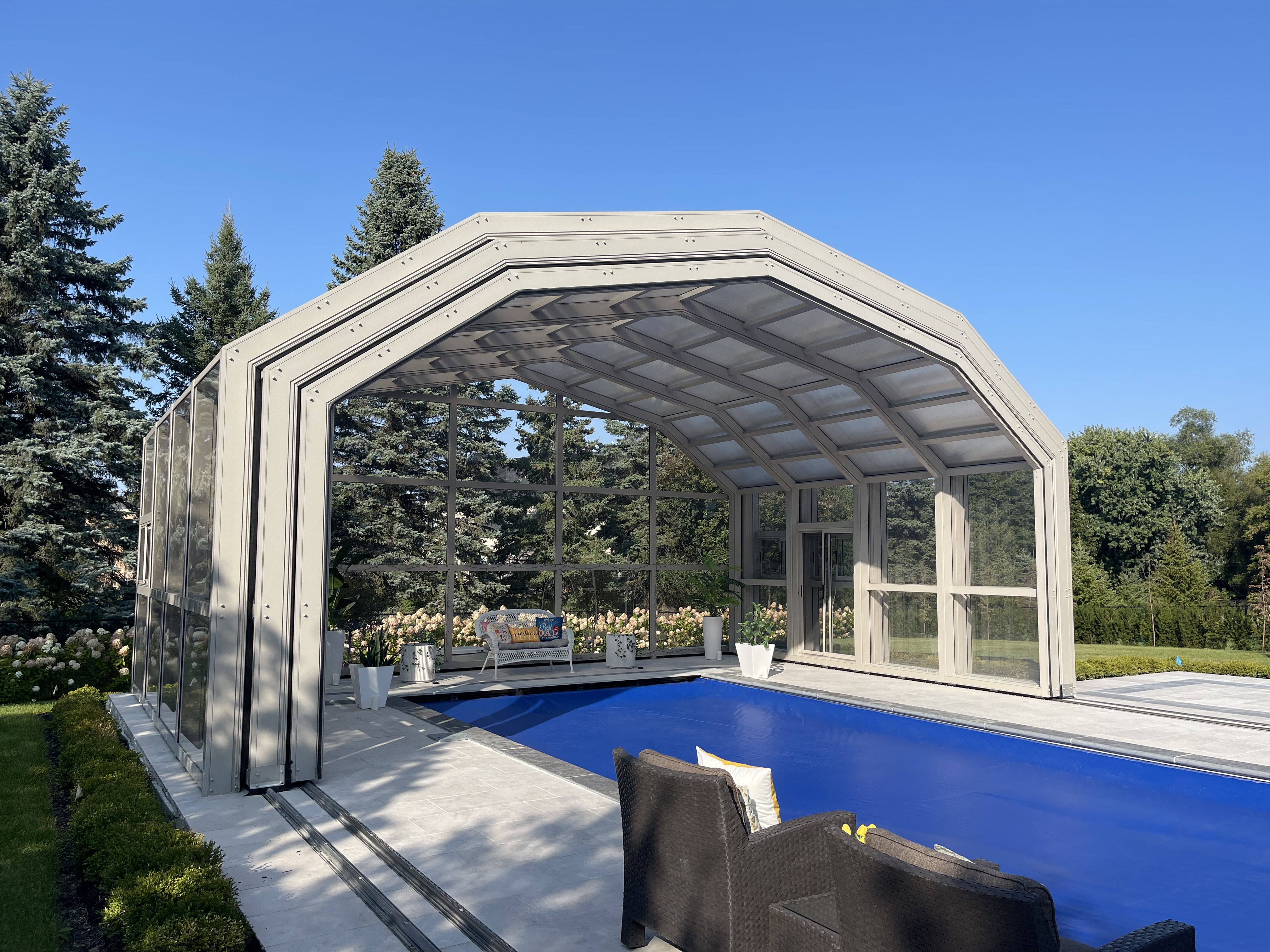 Front angled exterior view of retractable residential swim spa enclosure in Fort Saskatchewan